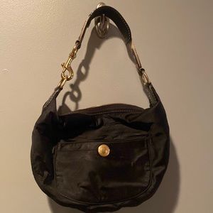 Coach Nylon small handbag with gold tone hardware and turquoise interior.